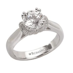 V Trellis Diamond Ring in 18kt White Gold. (D.1/8 carat total weight) This item is a SEMI-MOUNT and it comes with NO CENTER STONE as shown but it will accommodate a 6.5mm round center stone. Peg Head
