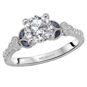 Diamonds line the shank of this beautiful ring and marquise cut saphires are on either side of a setting that will accommodate a 6.5mm round diamond. (D 1/8 carat total weight, S 1/5 carat total weight)