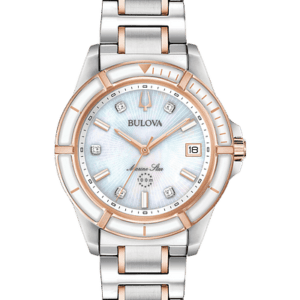 Bulova Marine Star Silver tone stainless steel case with rose gold tone accents and a white mother of pearl dial set with five diamonds. Three-hand calendar movement and flat mineral crystal. Water resistance to 100 meters