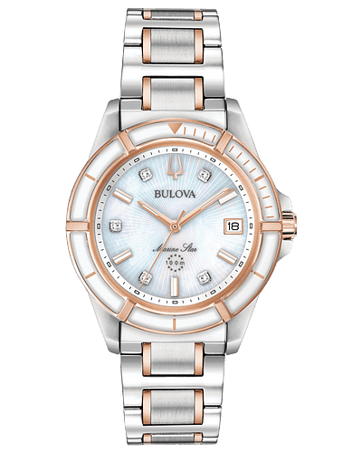 Bulova Marine Star Silver tone stainless steel case with rose gold tone accents and a white mother of pearl dial set with five diamonds. Three-hand calendar movement and flat mineral crystal. Water resistance to 100 meters
