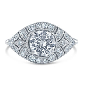 Fine milgrain detailing accentuates the geometric shapes created by solid 18K gold set with brilliant white diamonds against windows of open space.