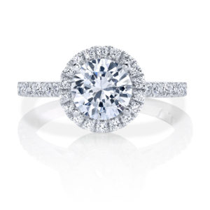 This New Classic has a sparkling band that leads up to a stunning halo featuring round diamonds that highlight a brilliant center stone.