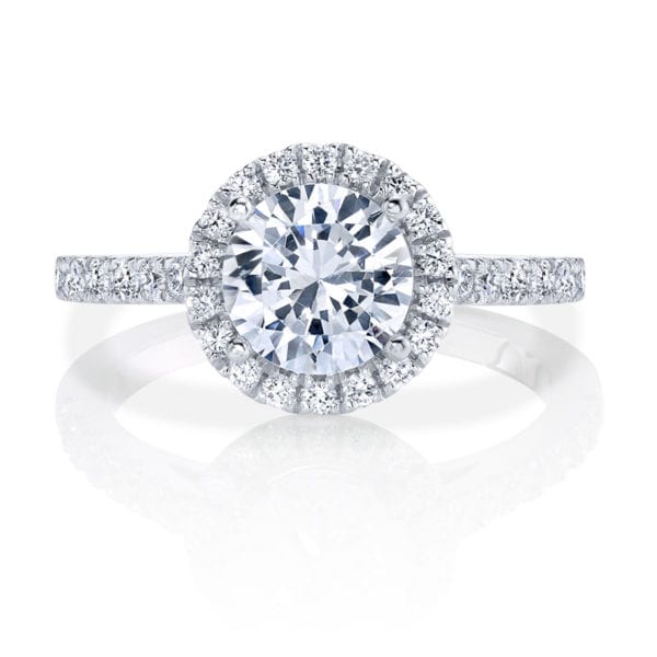 This New Classic has a sparkling band that leads up to a stunning halo featuring round diamonds that highlight a brilliant center stone.