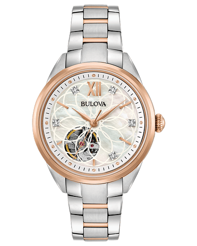 Ladies Bulova Automatic in stainless steel and rose gold-tone accents with 5 diamonds individually hand set on white mother-of-pearl dial with open aperture, exhibition case back, automatic heart-beat movement with 40-hour power reserve, domed sapphire crystal, two-tone rose gold and stainless steel bracelet with double-press deployment closure, and water resistance to 30 meters