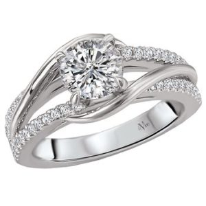 This Unique Ring is crafted in 14kt White Gold and Features Round Faceted Diamonds placed strategically along its Twisted Shank. (D 1/4 carat total weight) This ring is a SEMI-MOUNT and it comes with NO CENTER STONE as shown but it will accommodate a 6.5mm round center stone.