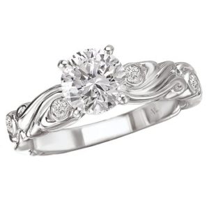 Swirl Designed Diamond Engagement Ring in 14kt White Gold. (D.08 carat total weight) This item is a SEMI-MOUNT and it comes with NO CENTER STONE as shown but it will accommodate a 6.5mm round center stone. Peg Head