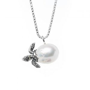 turtle hatching out of a pearl on a necklace