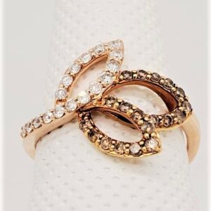 .52ctw Leaf Ring with Two Cafe' Diamond Leaves and One White set in 14k Rose Gold. *This item is clearance and is sold as is. This item is being sold in store as well as on the website. Availability is subject to change. Items from clearance cannot be refunded and are exchange only.