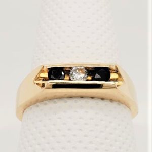 14K Yellow Gold Sapphire and Diamond Channel Set Ring. *This item is clearance and is sold as is. This item is being sold in store as well as on the website. Availability is subject to change. Items from clearance cannot be refunded and are exchange only.