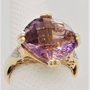 Ametrine Ring with .03ctw in Diamonds.*This item is clearance and is sold as is. This item is being sold in store as well as on the website. Availability is subject to change. Items from clearance cannot be refunded and are exchange only.